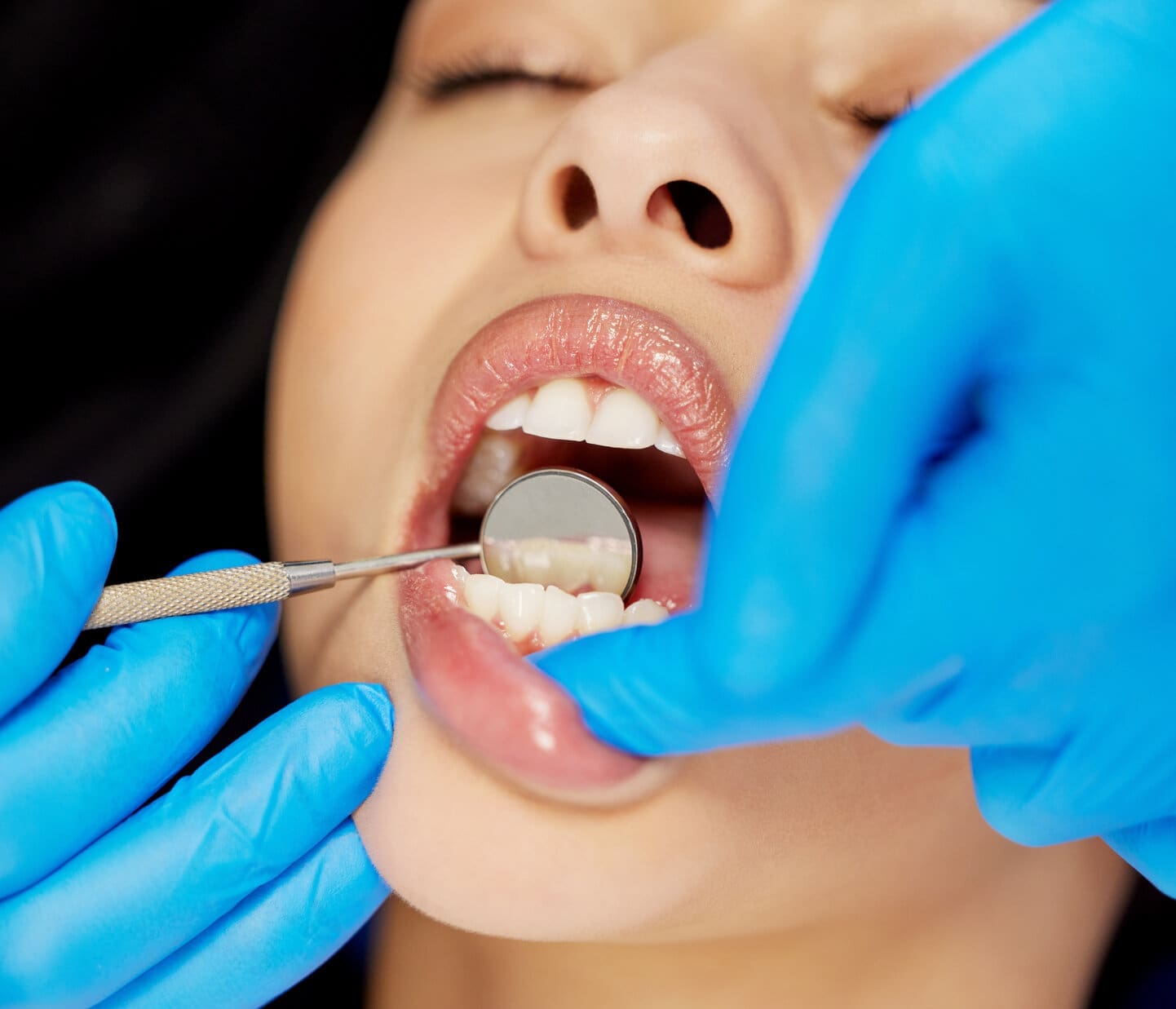 Shot of a young woman having a dental procedure performed on her.